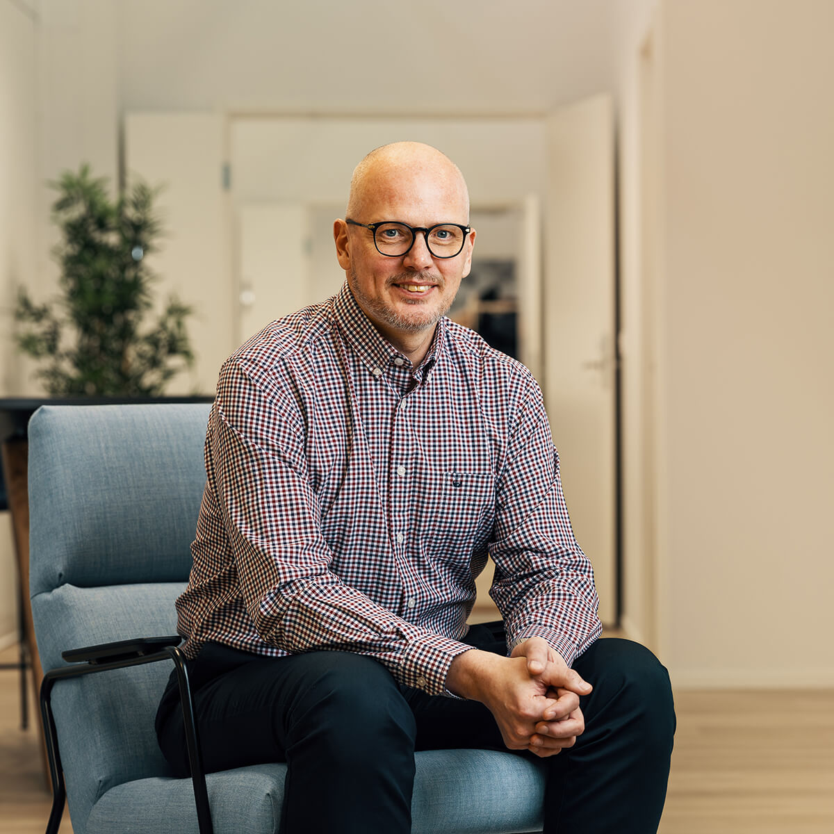 Kim Råholm, VEO's Development and HSEQ Director sitting at VEO's office